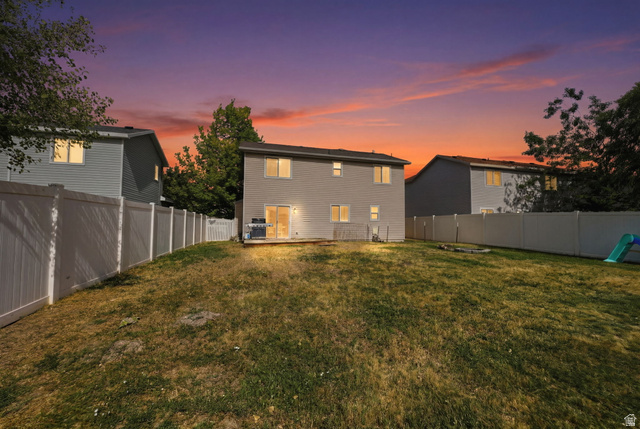 5485 Heather Way Tooele, UT 84074 - Photo 3 of 41 Spacious rear yard with a wooden deck and privacy fencing