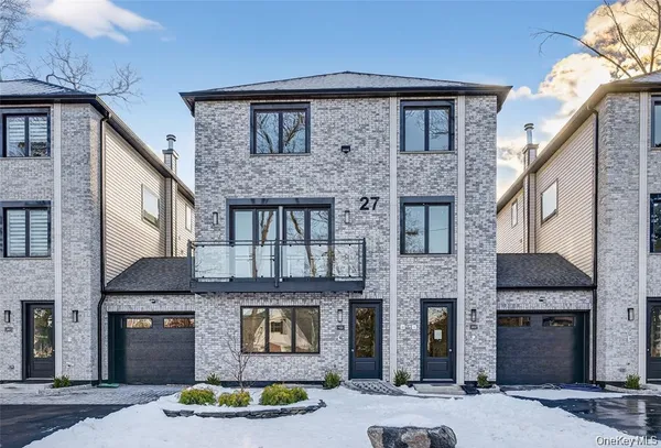 a front view of a house with yard