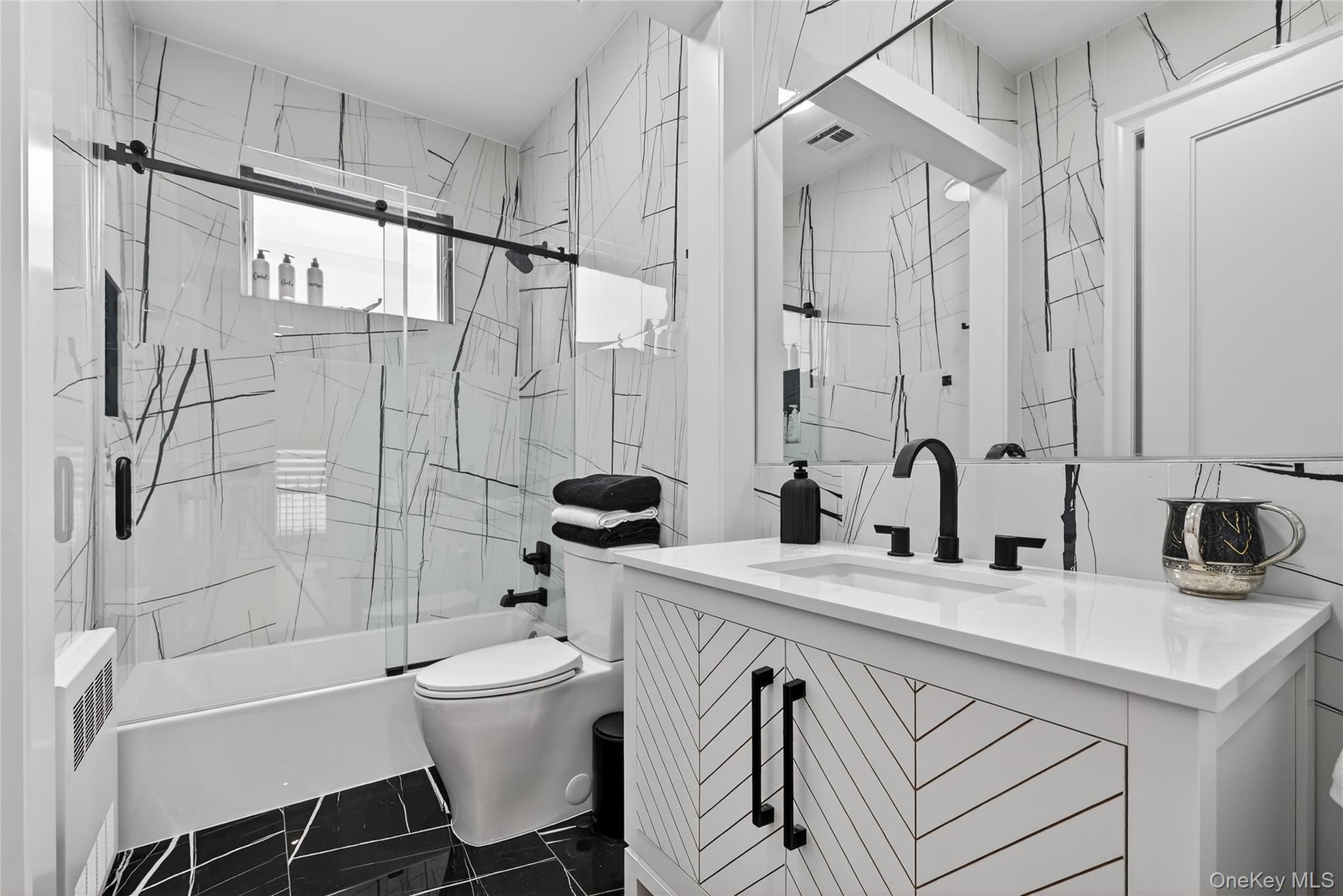 27 Ellish Parkway, Unit 203 Spring Valley, NY 10977 - Photo 26 of 47 a bathroom with a sink toilet tub and shower