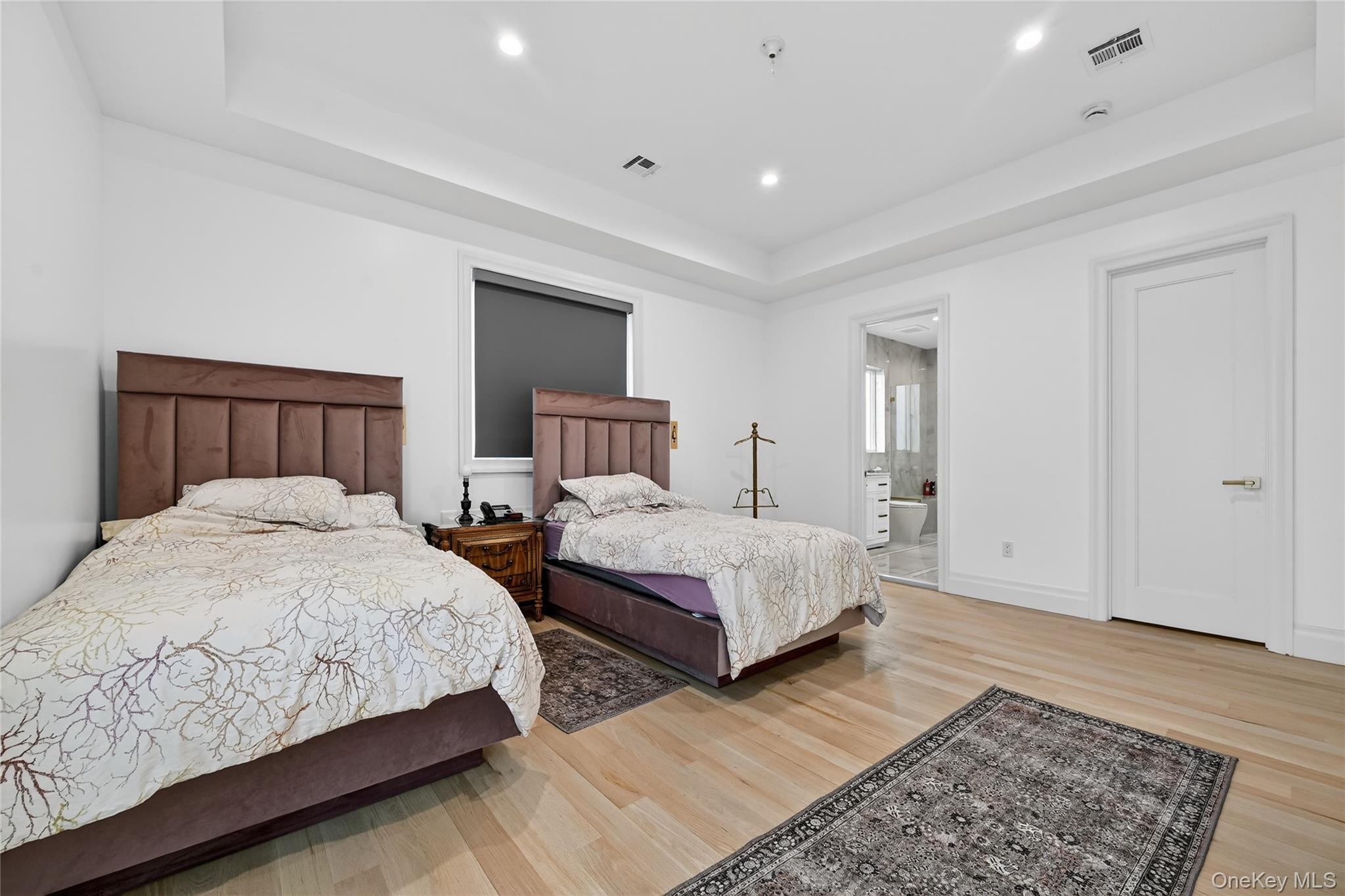 27 Ellish Parkway, Unit 203 Spring Valley, NY 10977 - Photo 32 of 47 a bedroom with two beds and a rug