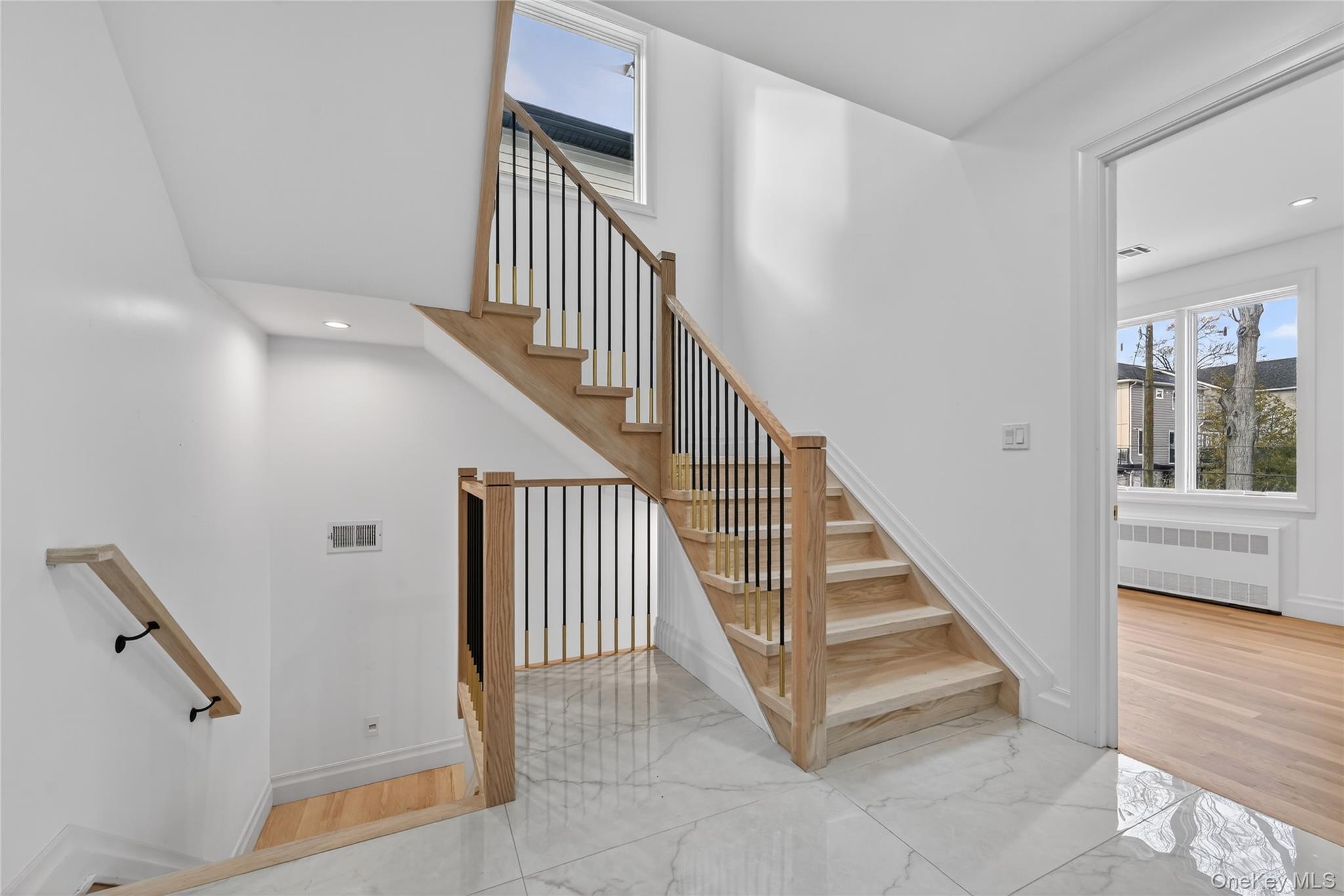 27 Ellish Parkway, Unit 203 Spring Valley, NY 10977 - Photo 40 of 47 a view of staircase with lots of frames and a rug