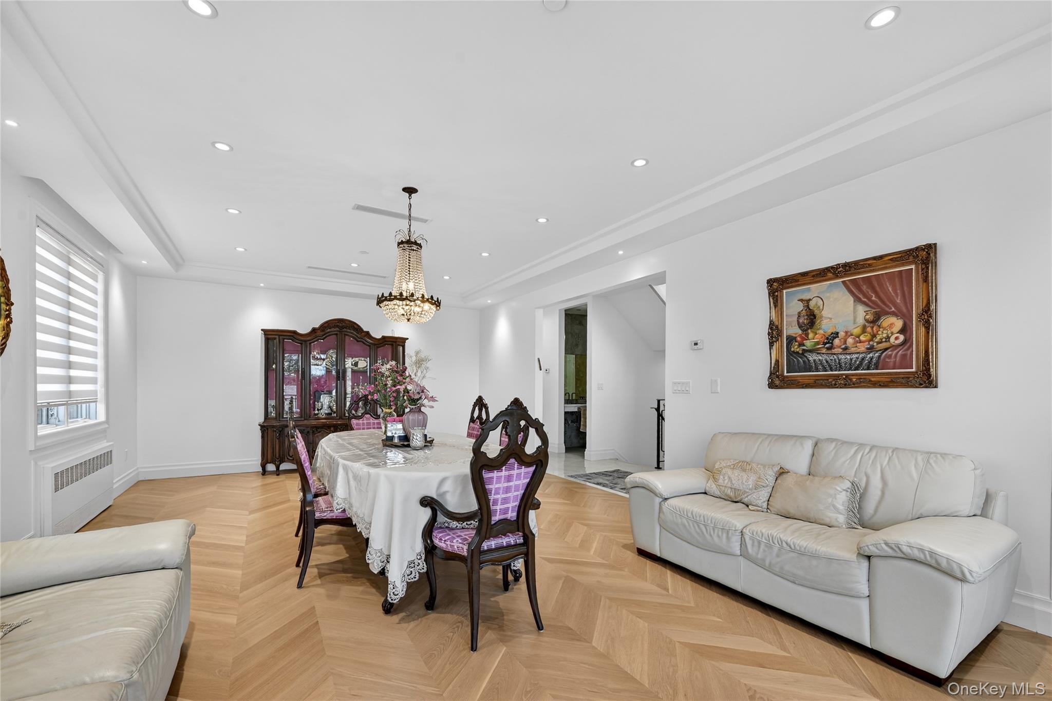 27 Ellish Parkway, Unit 203 Spring Valley, NY 10977 - Photo 4 of 47 a living room with furniture and a chandelier