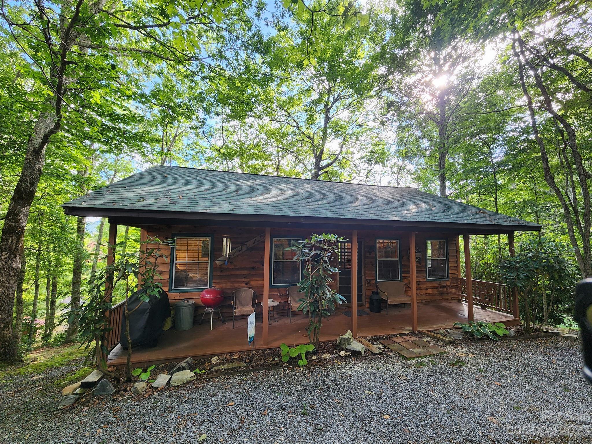 43 Brown Ridge Road Maggie Valley, NC 28751 - Photo 3 of 37 a view of a house with a backyard
