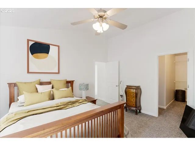 a bathroom with a double vanity sink a toilet and a mirror