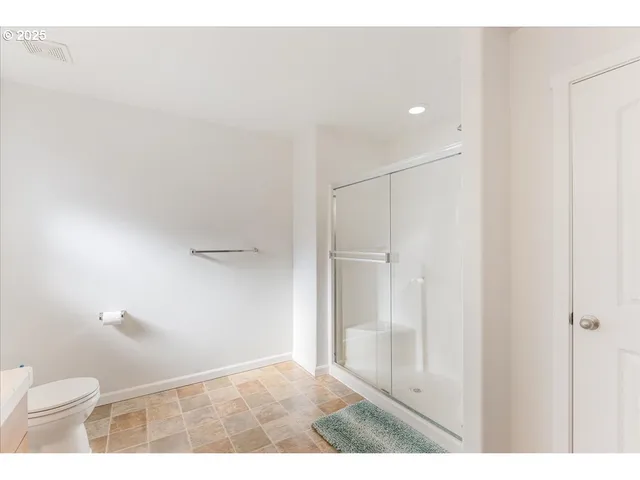 a bathroom with a sink a mirror and a toilet