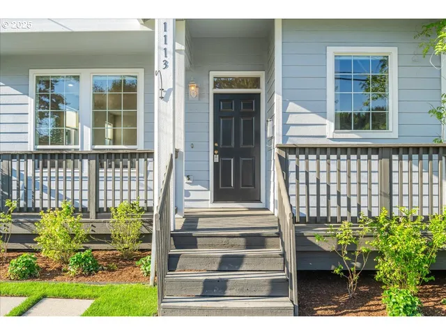a view of a brick house with a large window