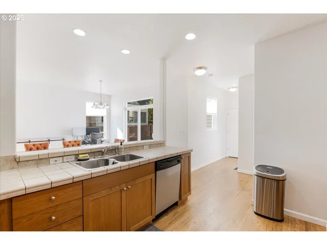a kitchen with a sink and a refrigerator