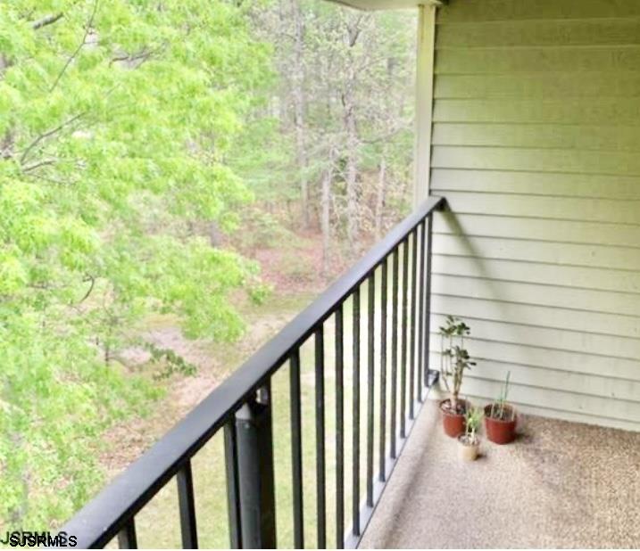 118 Sussex Place, Unit 118 Galloway Township, NJ 08205 - Photo 2 of 8 a view of balcony and trees