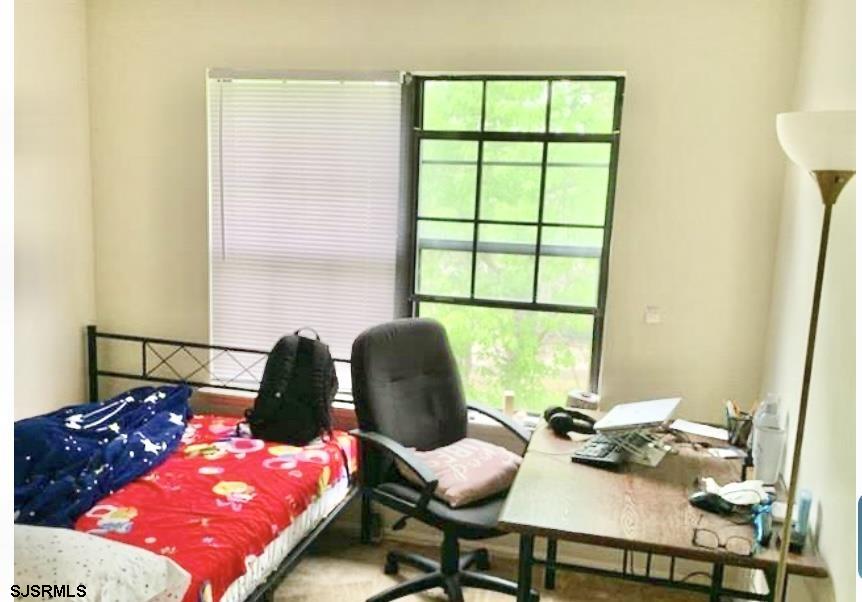 118 Sussex Place, Unit 118 Galloway Township, NJ 08205 - Photo 6 of 8 a bedroom with a bed and window