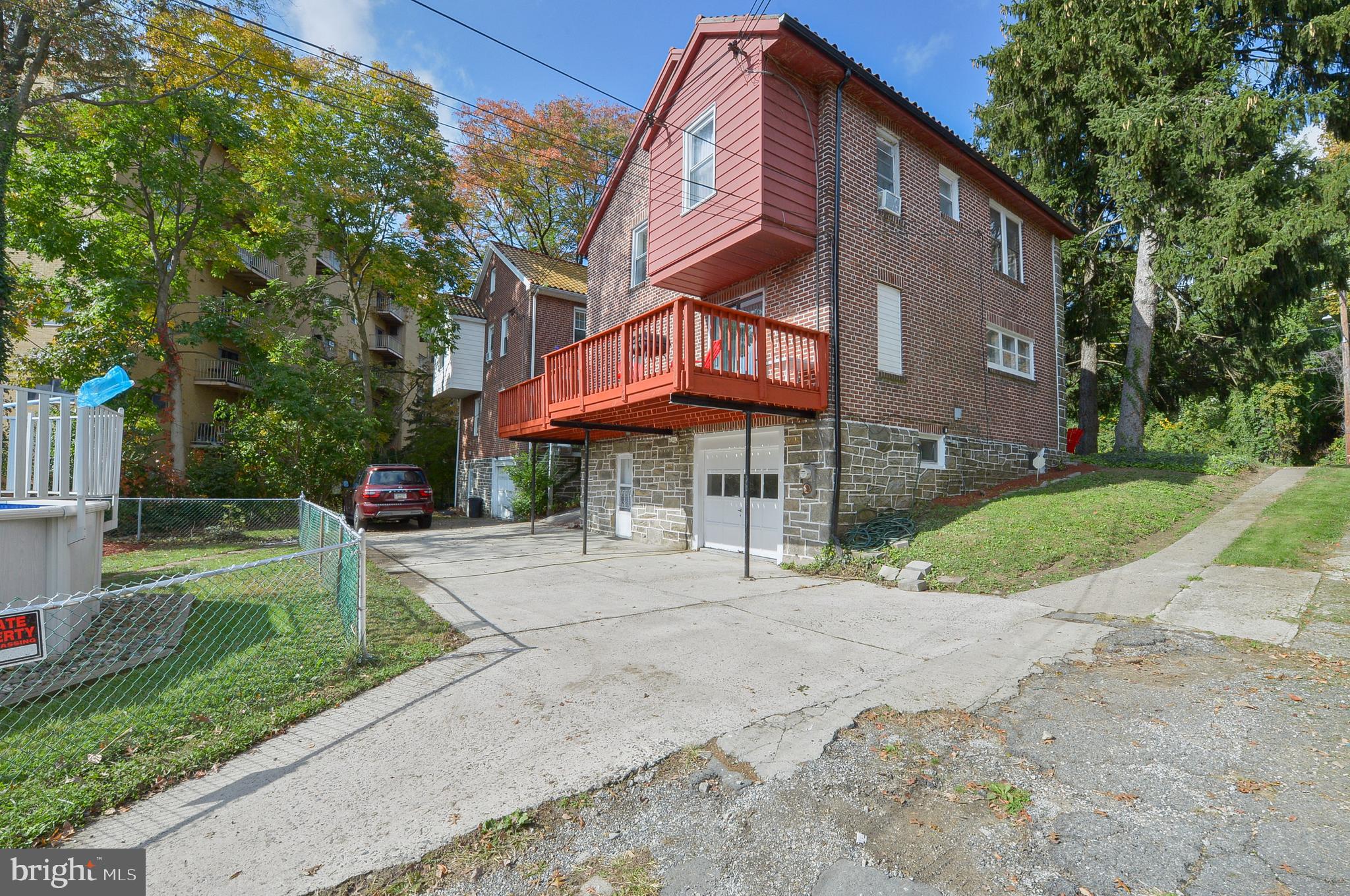4960 State Road Drexel Hill, PA 19026 - Photo 22 of 40 Rear deck, 1 cargarage, and parking, left exterior