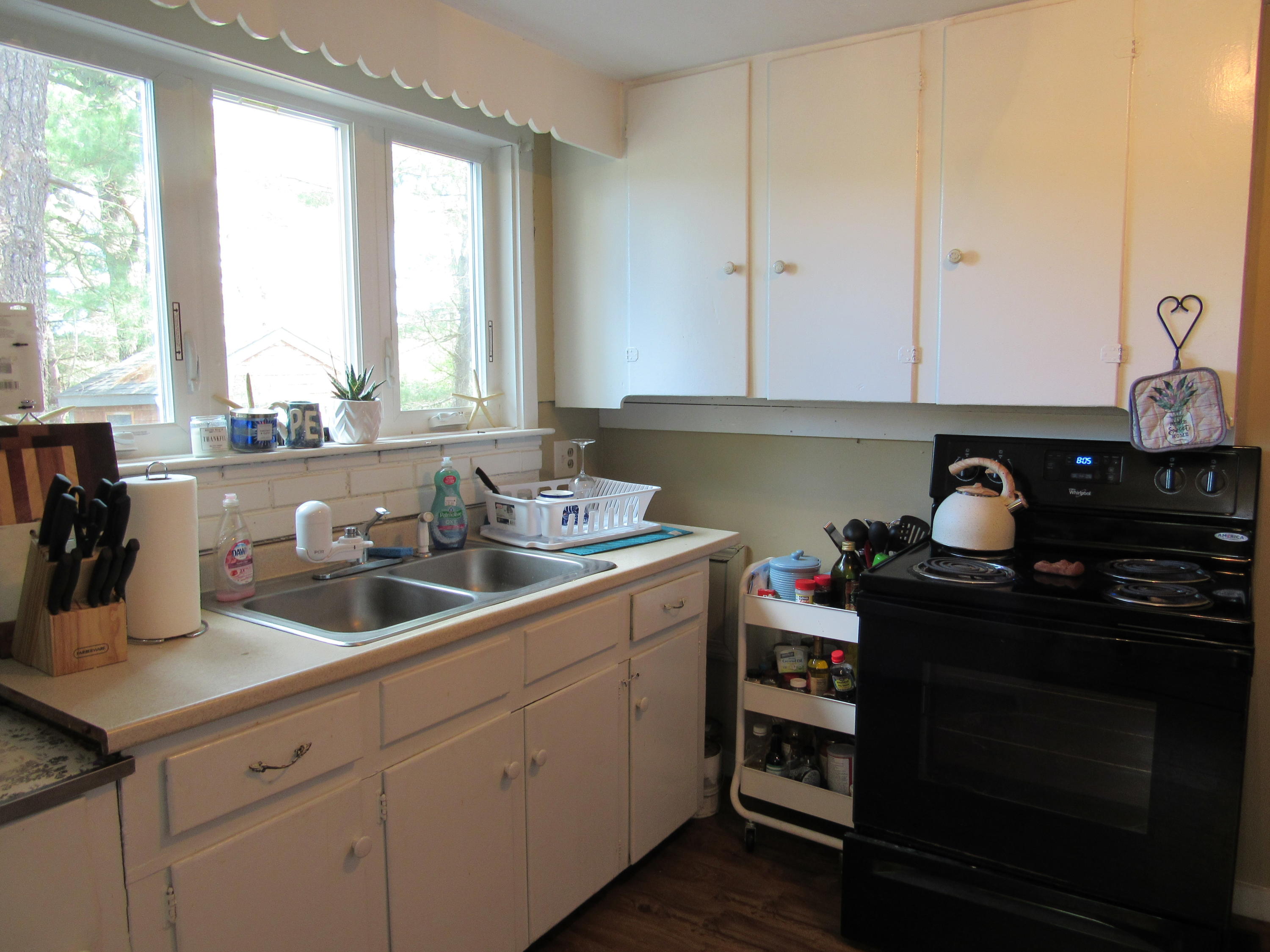 69 Nightingale Road Buzzards Bay, MA 02532 - Photo 3 of 21 a kitchen with a sink cabinets and window