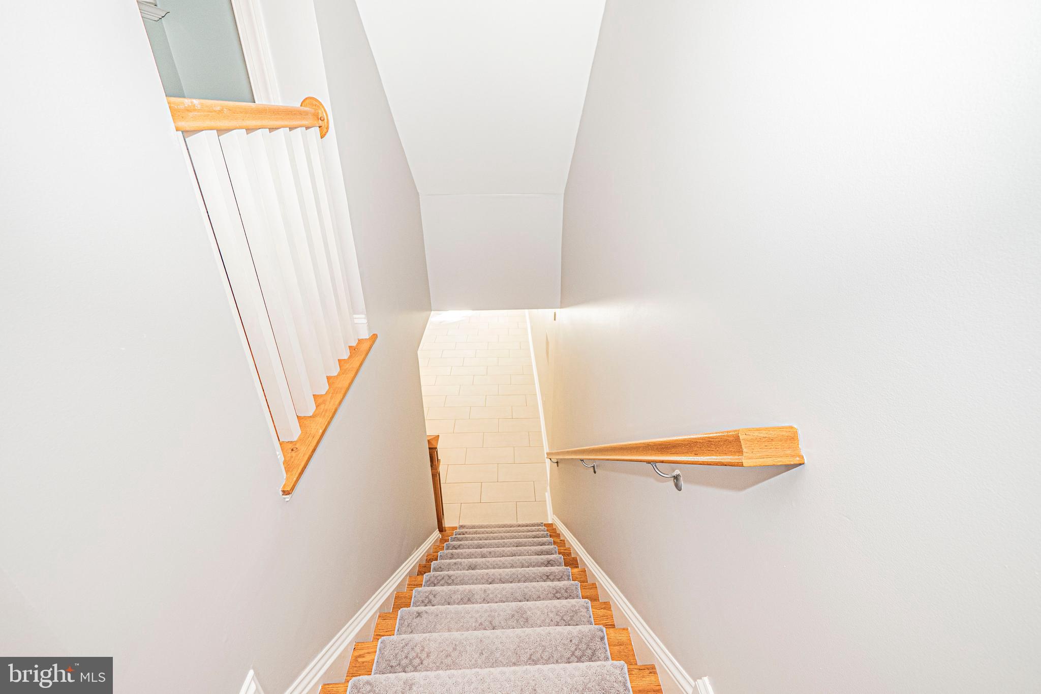 5448 Edsall Ridge Place Alexandria, VA 22312 - Photo 34 of 52 a view of staircase with white walls