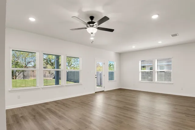 a view of kitchen with stove and a microwave
