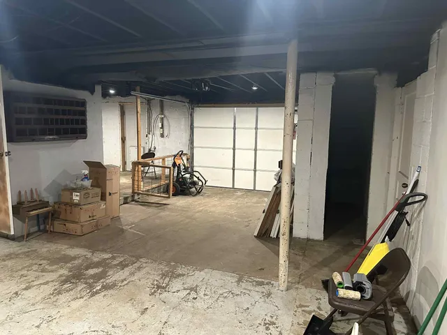 a view of a room with a window and wooden floor