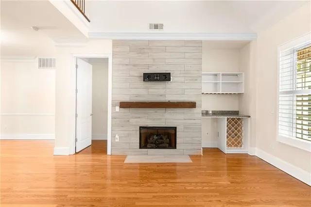 a kitchen with kitchen island white cabinets and stainless steel appliances
