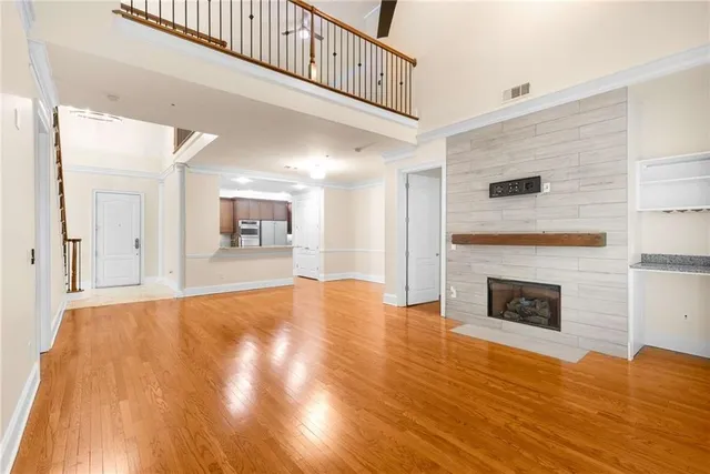 a kitchen with stainless steel appliances granite countertop a sink stove and microwave