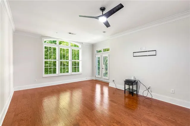 a bathroom with a granite countertop sink mirror and shower
