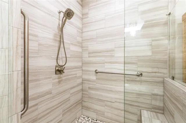 a bathroom with a bathtub and a shower