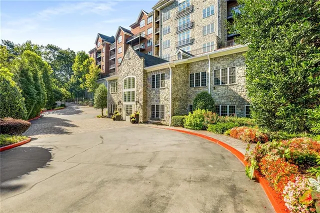 a view of a building with sitting area