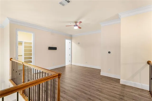 a view of a balcony with yard