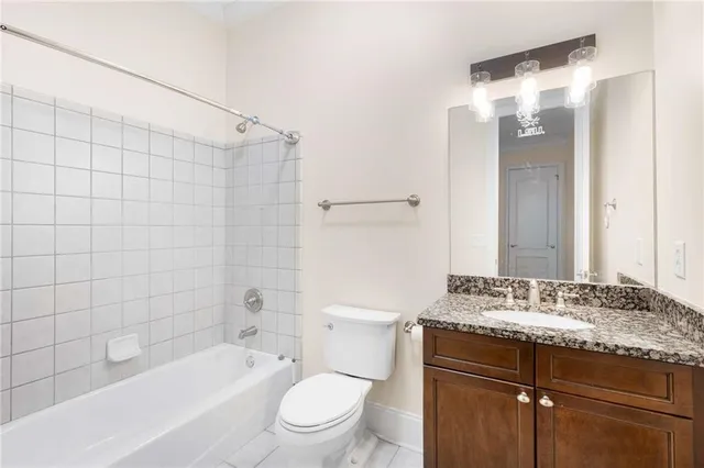 a view of a swimming pool with a lounge chairs and small yard