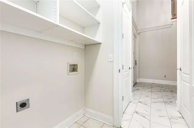 a living room with furniture large window and wooden floor