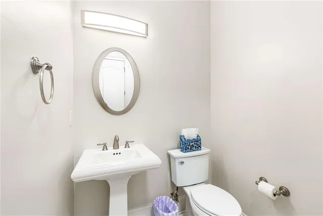 a living room with furniture large window and wooden floor