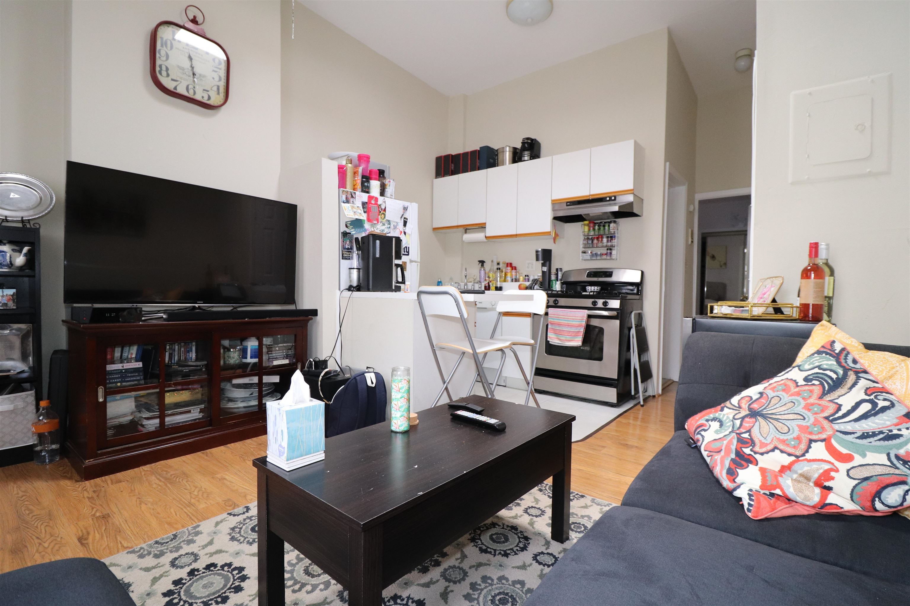 a living room with fireplace furniture and a flat screen tv