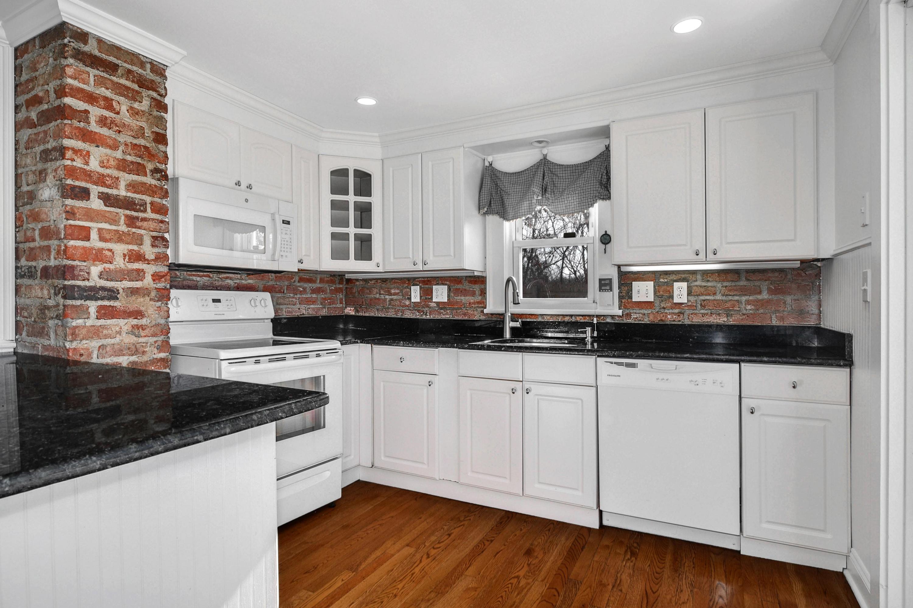 622 High Ridge Road Stamford, CT 06905 - Photo 3 of 19 a kitchen with stainless steel appliances granite countertop a sink and cabinets