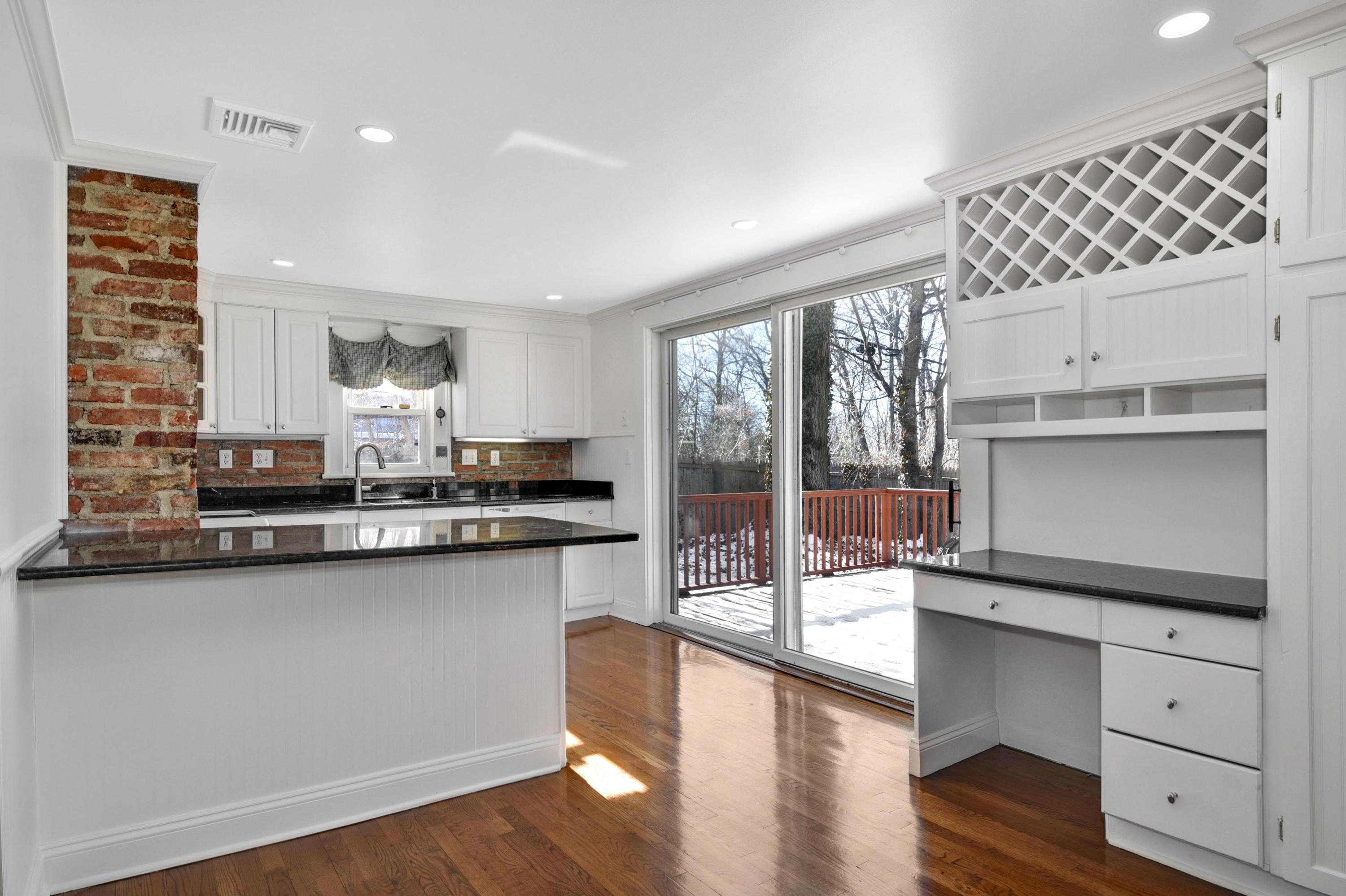 622 High Ridge Road Stamford, CT 06905 - Photo 4 of 19 a kitchen with a sink cabinets and wooden floor