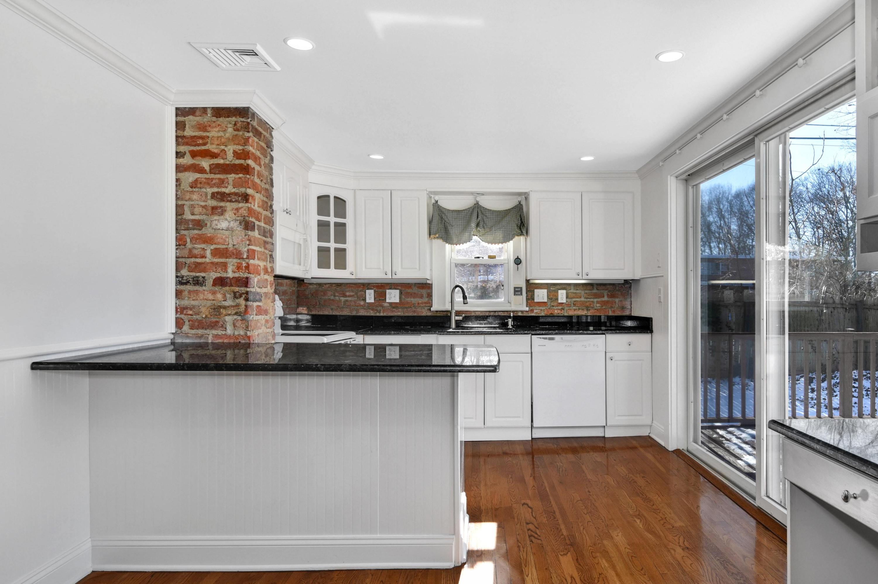 622 High Ridge Road Stamford, CT 06905 - Photo 5 of 19 a kitchen with stainless steel appliances granite countertop a stove a sink and a refrigerator