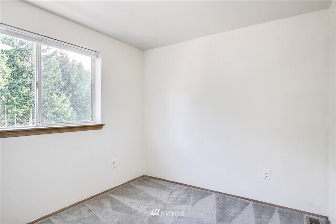 3939 10th Street Southeast, Unit A2 Puyallup, WA 98374 - Photo 14 of 27 an empty room with a window