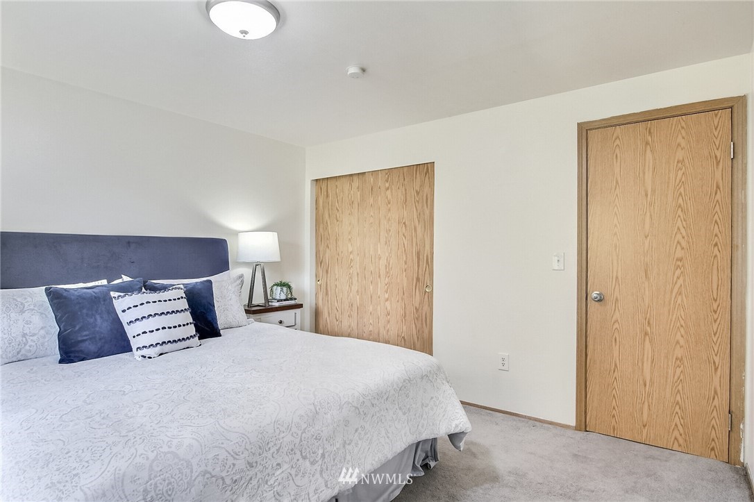 3939 10th Street Southeast, Unit A2 Puyallup, WA 98374 - Photo 18 of 27 a bedroom with a bed and a window