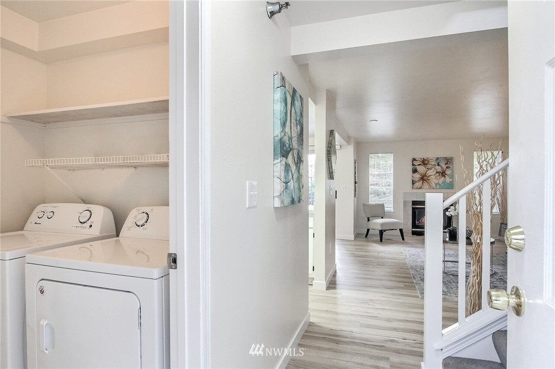 3939 10th Street Southeast, Unit A2 Puyallup, WA 98374 - Photo 3 of 27 a view of a hallway with washer and dryer