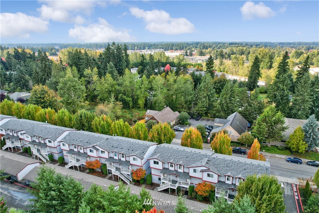 3939 10th Street Southeast, Unit A2 Puyallup, WA 98374 - Photo 25 of 27 an aerial view of residential houses with outdoor space and swimming pool