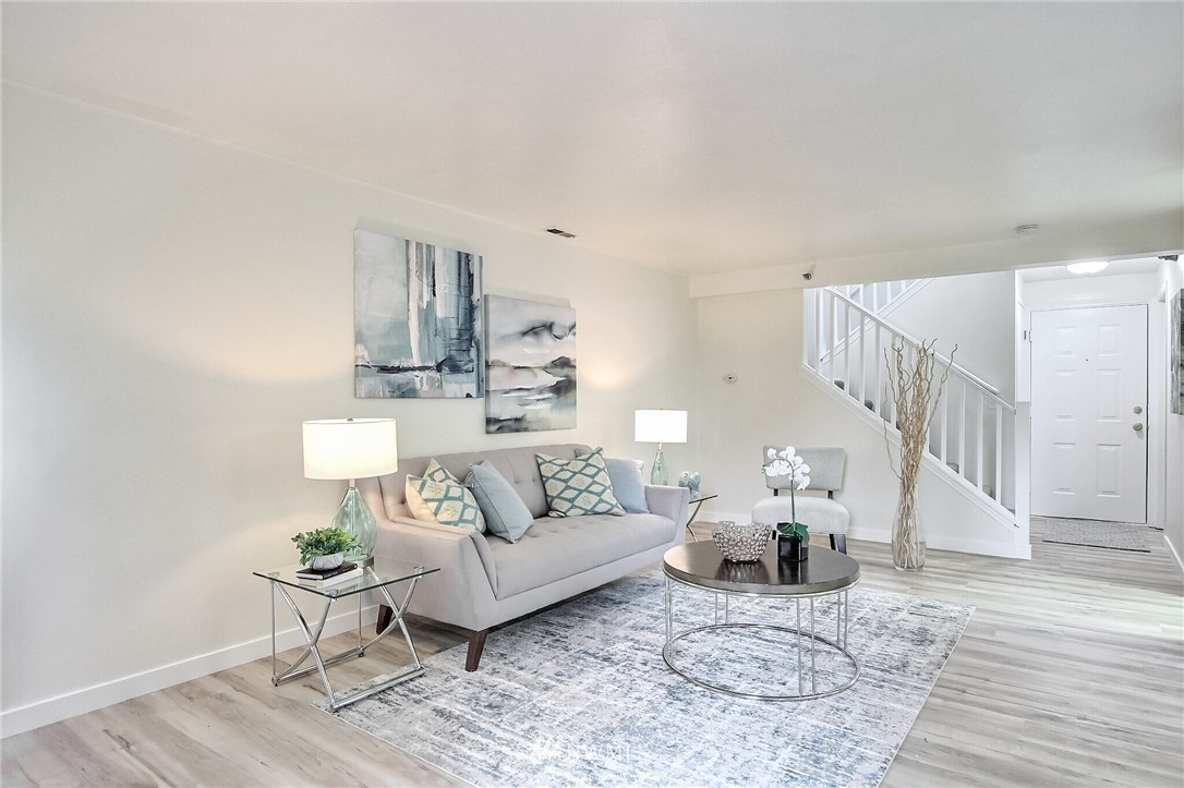 3939 10th Street Southeast, Unit A2 Puyallup, WA 98374 - Photo 5 of 27 a living room with furniture and wooden floor