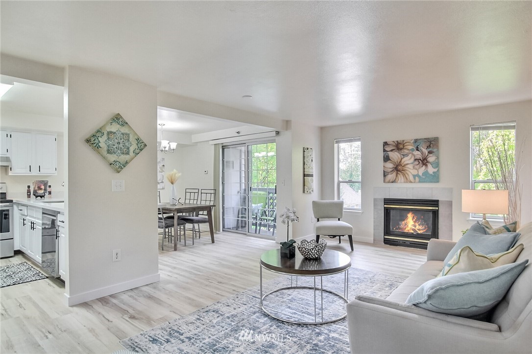 3939 10th Street Southeast, Unit A2 Puyallup, WA 98374 - Photo 7 of 27 a living room with furniture and a fireplace