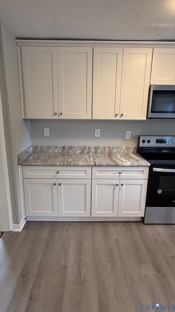 1424 Decatur Street Richmond, VA 23224 - Photo 9 of 30 a white kitchen with granite countertop white cabinets and sink