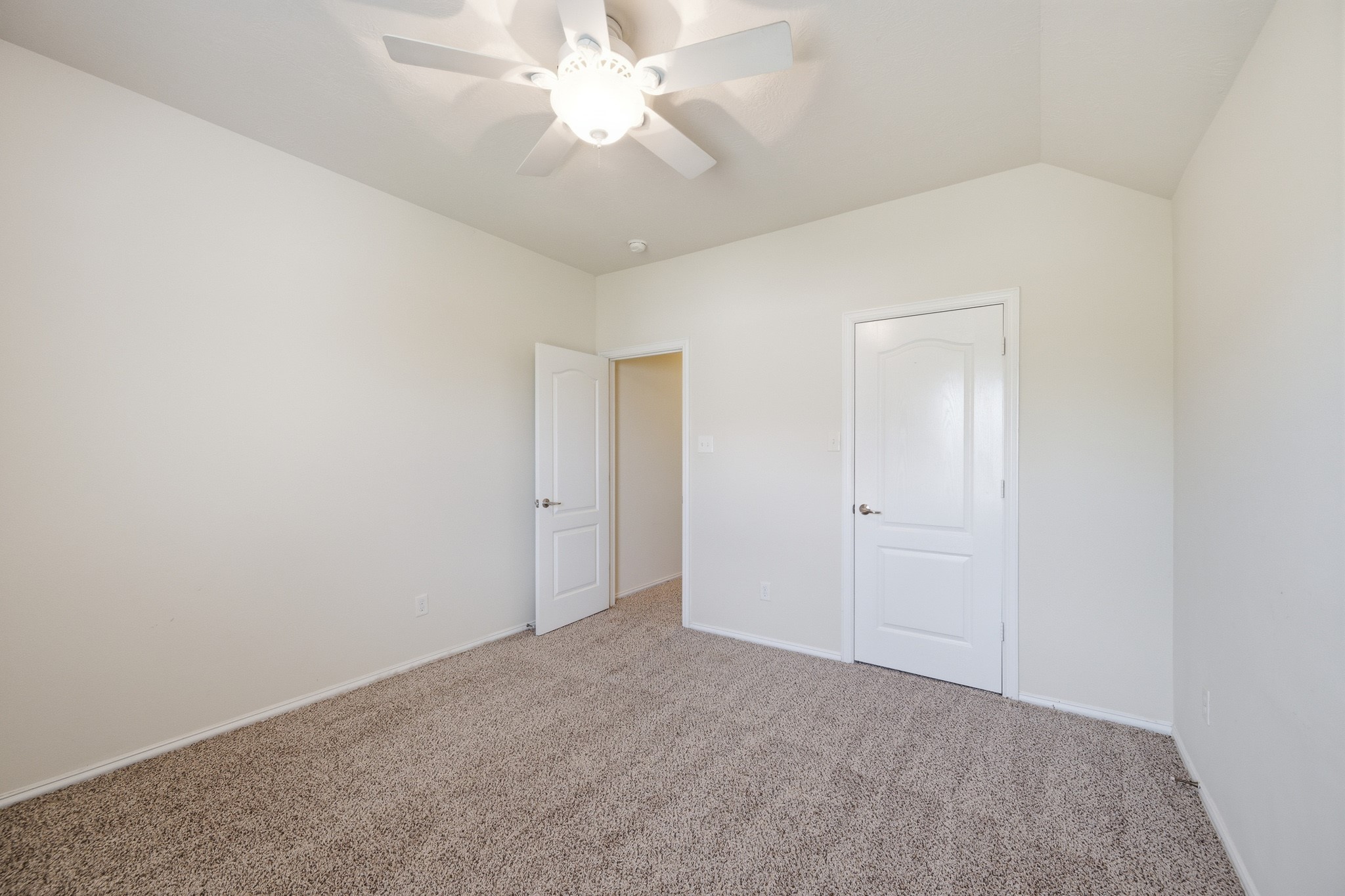 2117 Rushing Spring Drive Pearland, TX 77584 - Photo 39 of 42 Discover the inviting charm of bedroom 4, featuring plush carpeting, a soothing neutral palette, and ample natural light for a serene retreat.