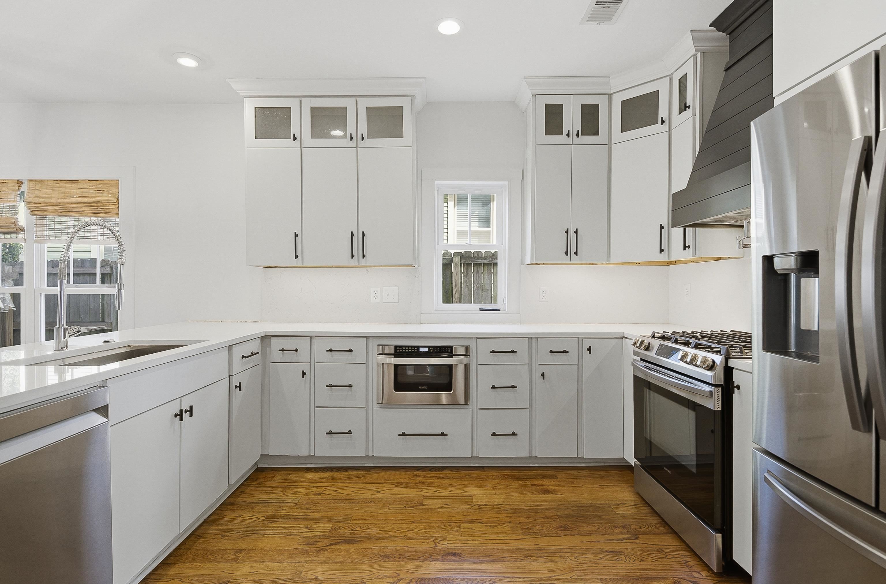1925 Evelyn Avenue Memphis, TN 38104 - Photo 24 of 30 a kitchen with stainless steel appliances granite countertop a stove a sink and a refrigerator