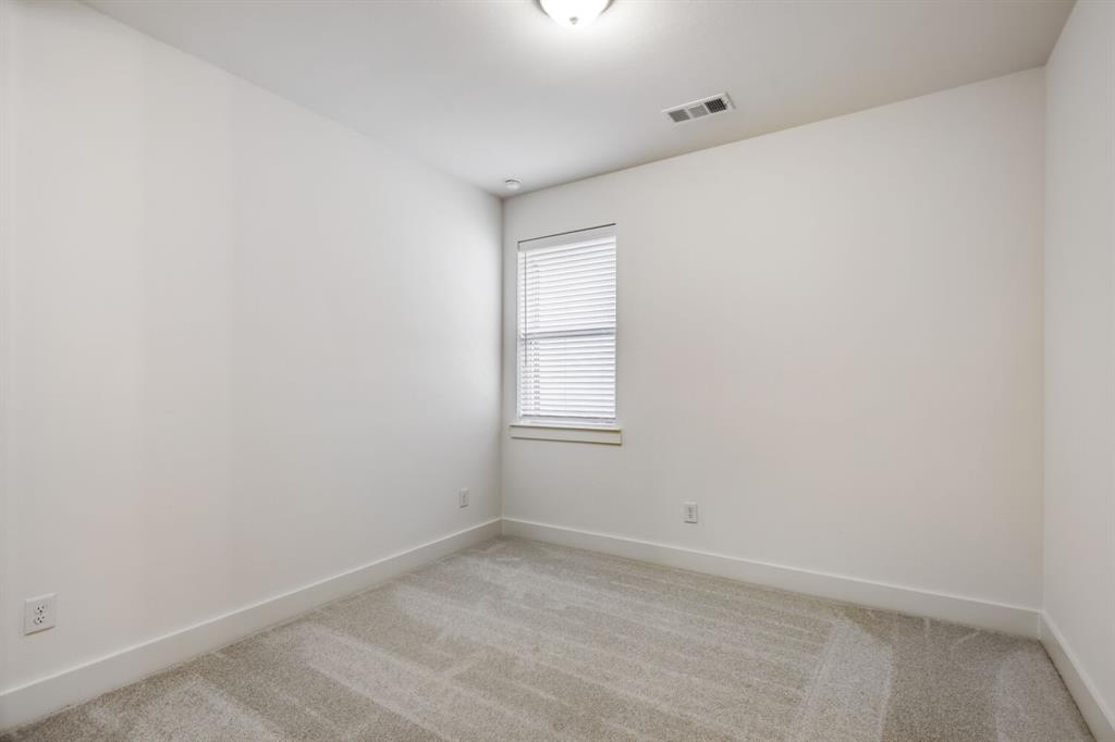 4314 Haley Way Oak Point, TX 75068 - Photo 15 of 28 Neutral wall paint, light gray carpet, window with blinds, recessed lighting, and white baseboards