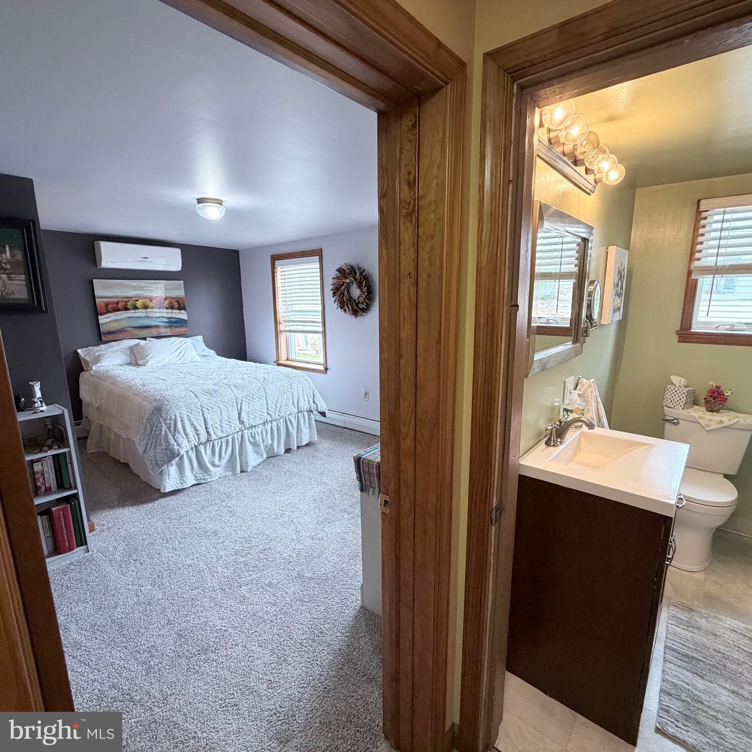 12997 Main Street Fort Loudon, PA 17224 - Photo 34 of 48 a bedroom with a bed and a chandelier