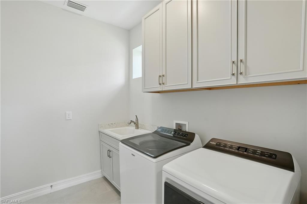28165 Captiva Shell Loop Bonita Springs, FL 34135 - Photo 26 of 38 a utility room with dryer and washer