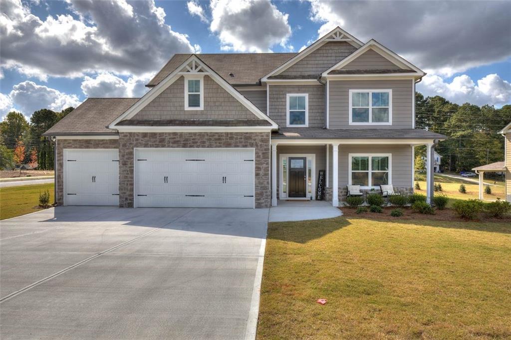 91 Elivia Way Dallas, GA 30132 - Photo 1 of 1 front view of a house with a yard