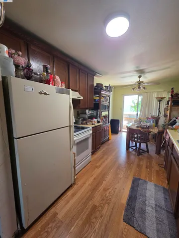 a refrigerator freezer sitting inside of a kitchen