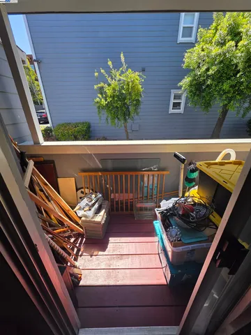 a view of a balcony with chairs