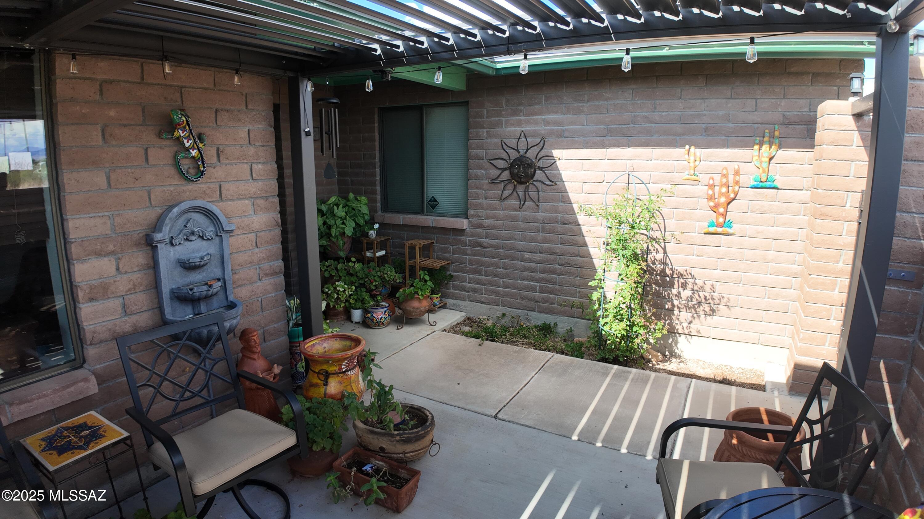 995 Jar Court Rio Rico, AZ 85648 - Photo 8 of 44 a backyard of a house with outdoor seating