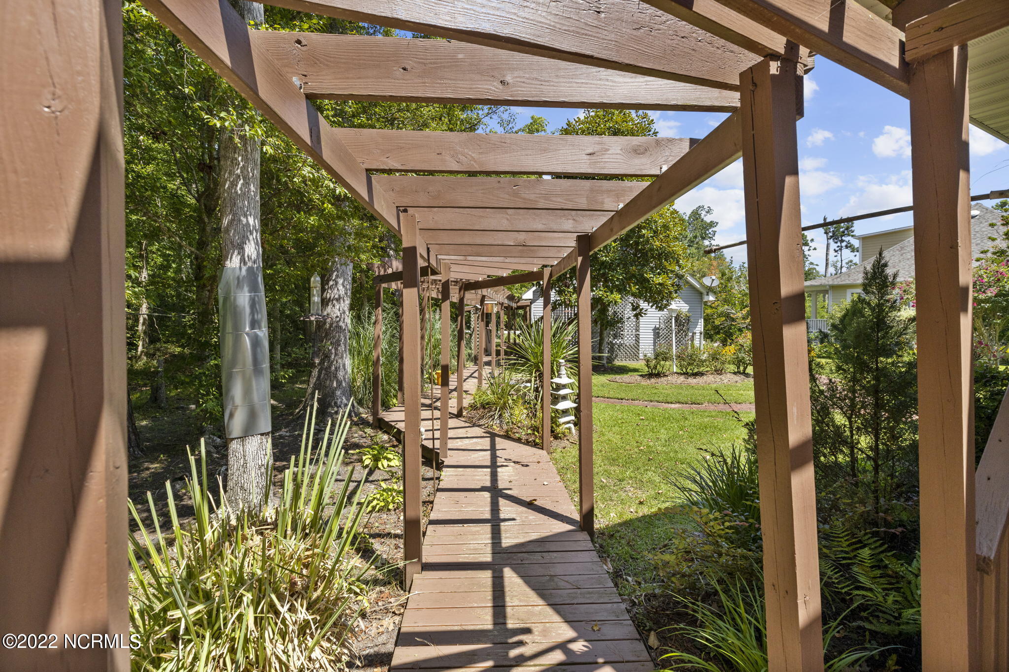 1141 Hardison Lee Farm Road Arapahoe, NC 28510 - Photo 52 of 57 Walkway from home to garage and workshop