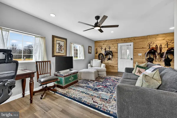 a living room with furniture and a fireplace