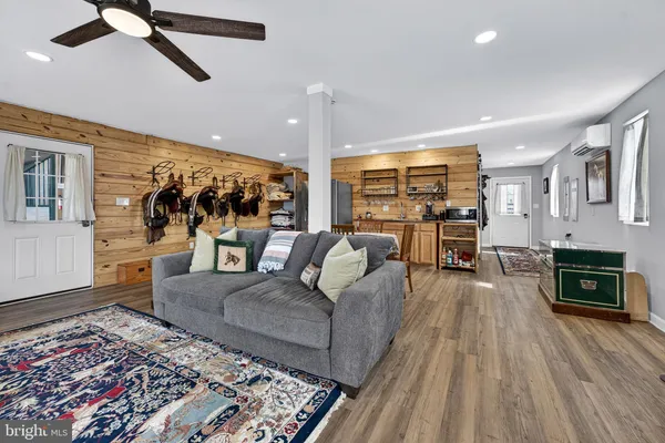 a dining room with furniture and wooden floor